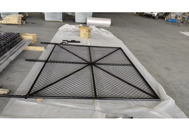 Sliding chain link fence gate installation with heavy-duty hardware for commercial perimeter